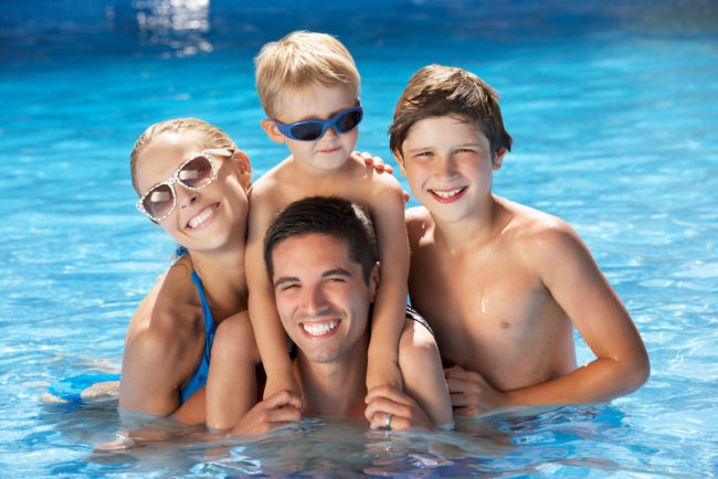 Family swimming Pool safety family having fun - swimming pool safety