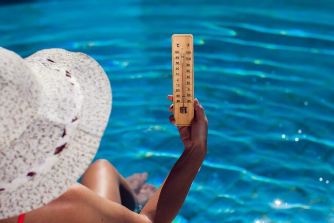 woman holding Pool Temperature