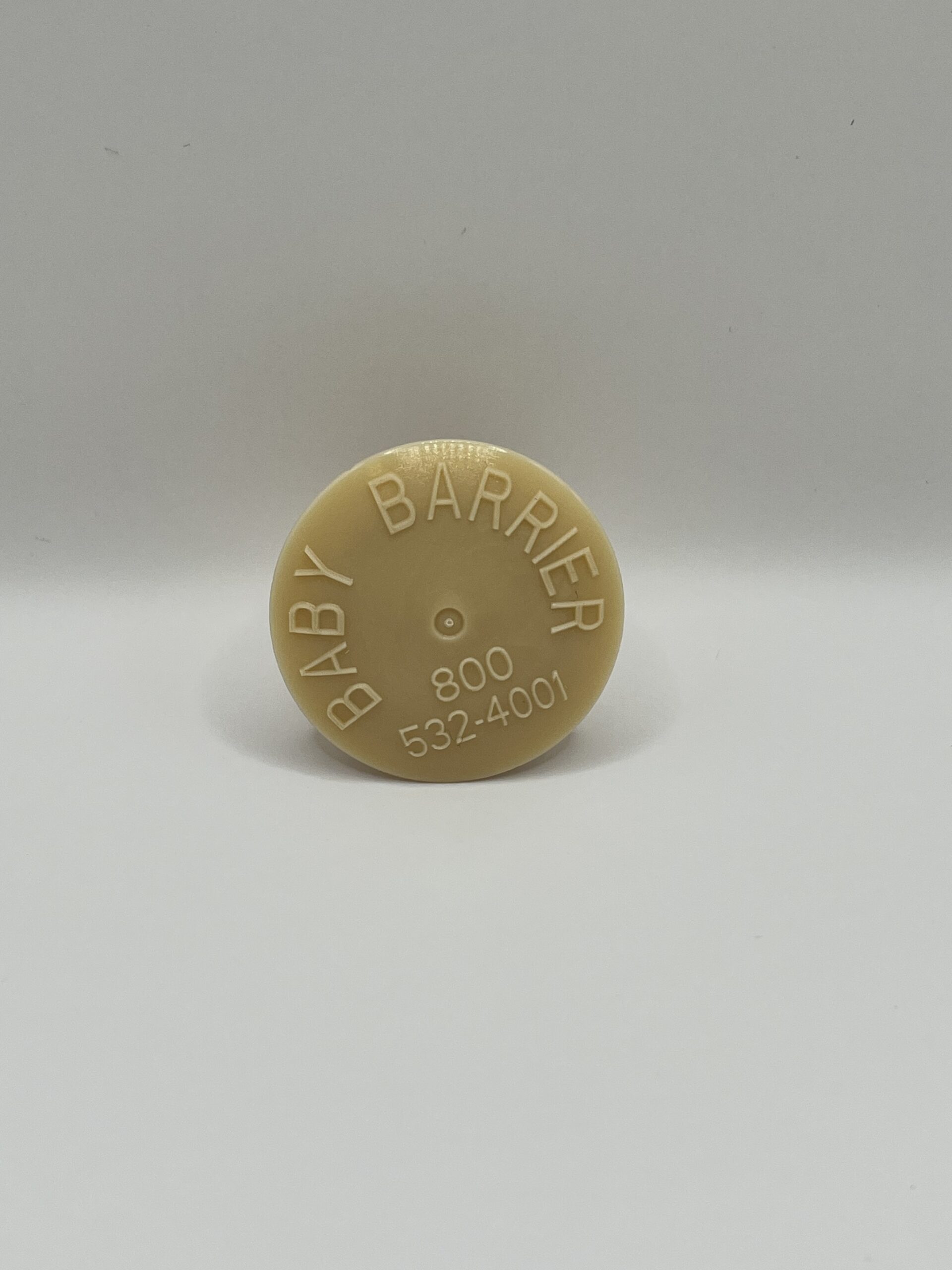 a round baby barrier pool cap with text on it
